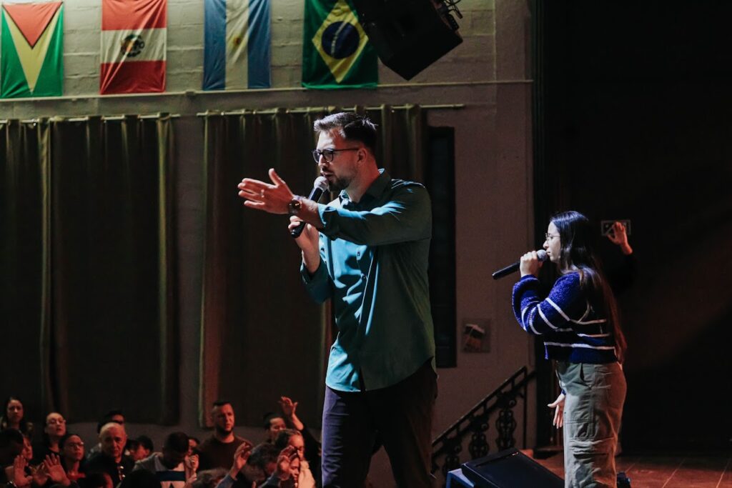 Nathanael Ehn preaching on stage